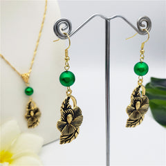 Set Of Hawaiian Carved Hibiscus Flower And Leaves Earrings And Necklace Sustained With A Pearl In Different Colors