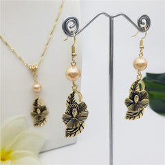 Set Of Hawaiian Carved Hibiscus Flower And Leaves Earrings And Necklace Sustained With A Pearl In Different Colors