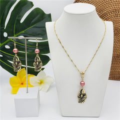 Set Of Hawaiian Carved Hibiscus Flower And Leaves Earrings And Necklace Sustained With A Pearl In Different Colors