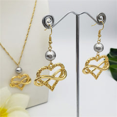 Set Of Infinity Carved Heart Earrings And Necklace Sustained With A Pearl In Different Colors