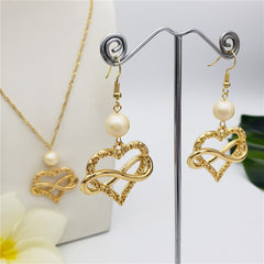 Set Of Infinity Carved Heart Earrings And Necklace Sustained With A Pearl In Different Colors