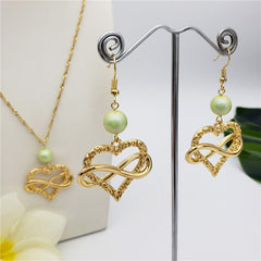 Set Of Infinity Carved Heart Earrings And Necklace Sustained With A Pearl In Different Colors