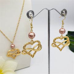 Set Of Infinity Carved Heart Earrings And Necklace Sustained With A Pearl In Different Colors