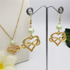 Set Of Infinity Carved Heart Earrings And Necklace Sustained With A Pearl In Different Colors