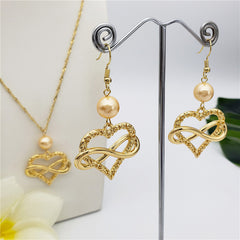 Set Of Infinity Carved Heart Earrings And Necklace Sustained With A Pearl In Different Colors