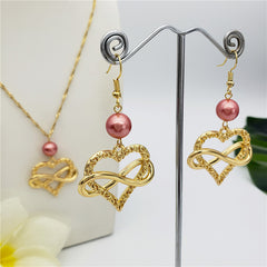 Set Of Infinity Carved Heart Earrings And Necklace Sustained With A Pearl In Different Colors