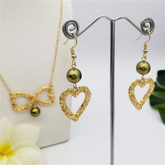 Set Of Carved Heart Earrings And Carved Heart Infinity Necklace Sustained With A Pearl In Different Colors