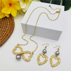 Set Of Carved Heart Earrings And Carved Heart Infinity Necklace Sustained With A Pearl In Different Colors