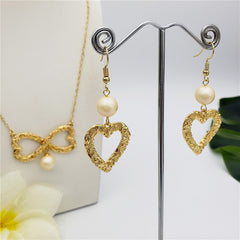 Set Of Carved Heart Earrings And Carved Heart Infinity Necklace Sustained With A Pearl In Different Colors