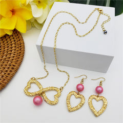 Set Of Carved Heart Earrings And Carved Heart Infinity Necklace Sustained With A Pearl In Different Colors