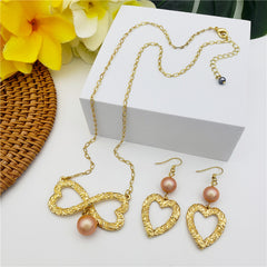 Set Of Carved Heart Earrings And Carved Heart Infinity Necklace Sustained With A Pearl In Different Colors