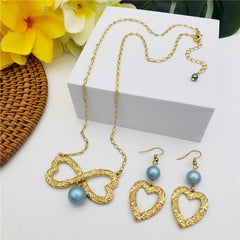 Set Of Carved Heart Earrings And Carved Heart Infinity Necklace Sustained With A Pearl In Different Colors