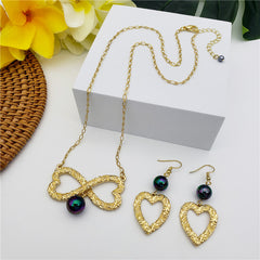 Set Of Carved Heart Earrings And Carved Heart Infinity Necklace Sustained With A Pearl In Different Colors