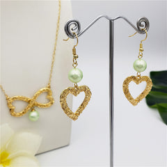 Set Of Carved Heart Earrings And Carved Heart Infinity Necklace Sustained With A Pearl In Different Colors