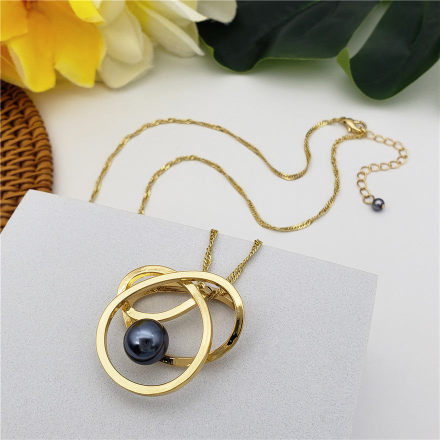 Set Of Petrol Pearl Stud Earrings And Petrol Pearl Tangle Necklace In Silver/Gold