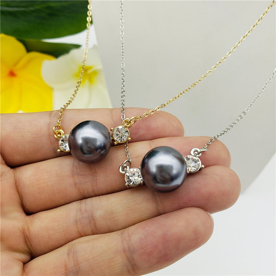 Set Of Petrol Pearl Stud Earrings And Eye Of The Petrol Pearl Necklace In Silver/Gold With White Zircons