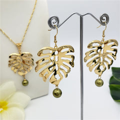 Set Of Hawaiian Monstera Leaf Earrings And Necklace Sustained With A Pearl From The Bottom In Different Colors