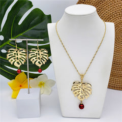 Set Of Hawaiian Monstera Leaf Earrings And Necklace Sustained With A Pearl From The Bottom In Different Colors