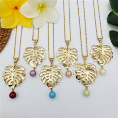 Set Of Hawaiian Monstera Leaf Earrings And Necklace Sustained With A Pearl From The Bottom In Different Colors