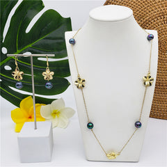 Set Of Hawaiian Earrings And Necklace With Plumeria Flowers And Metallic Green-Purple Pearls