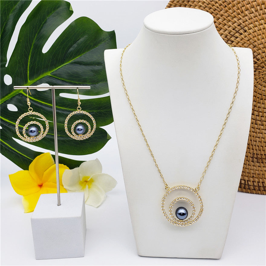 Set Of An Eye Of A Petrol Pearl With White Zircons Earrings And Necklace