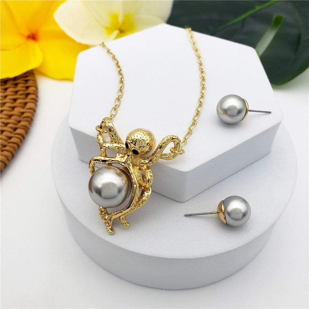 Set Of Pearl Stud Earrings And Octopus Necklace Holding A Pearl In Different Colors