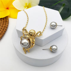 Set Of Pearl Stud Earrings And Octopus Necklace Holding A Pearl In Different Colors