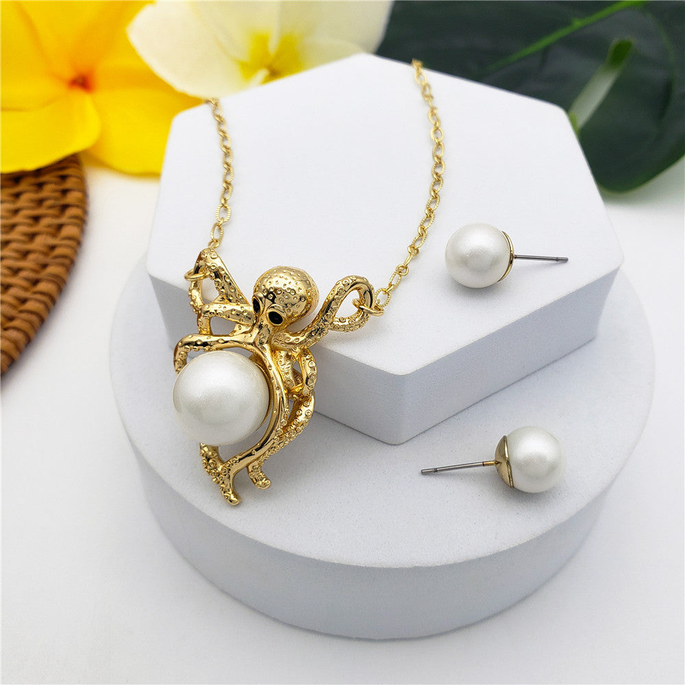 Set Of Pearl Stud Earrings And Octopus Necklace Holding A Pearl In Different Colors