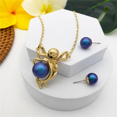 Set Of Pearl Stud Earrings And Octopus Necklace Holding A Pearl In Different Colors