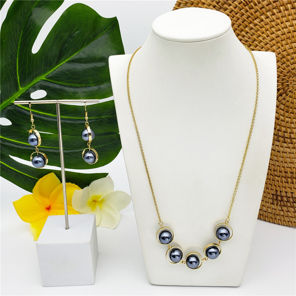 Set Of Pearl In A Small Golden Circles Earrings And Necklace In Different Styles And Colors