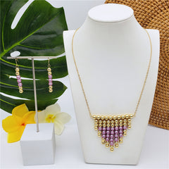 Set Of Hawaiian Earrings And Necklace With Golden Beads Centered With Beads In Different Colors