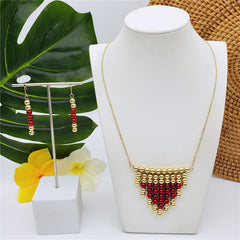 Set Of Hawaiian Earrings And Necklace With Golden Beads Centered With Beads In Different Colors