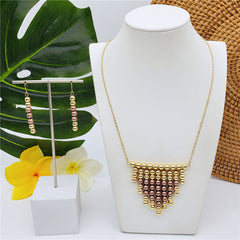 Set Of Hawaiian Earrings And Necklace With Golden Beads Centered With Beads In Different Colors