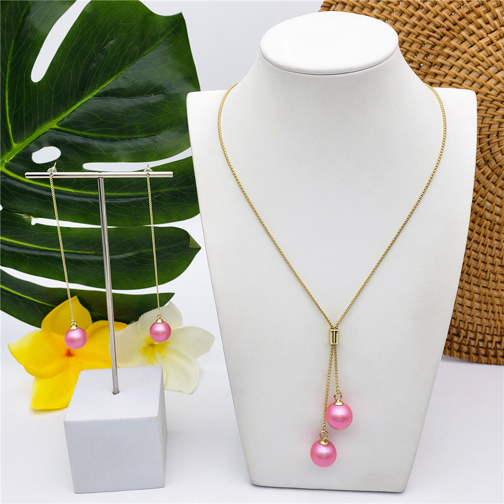 Set Of Chain Drop Earrings And Necklace Sustained With A Pearl In Different Colors