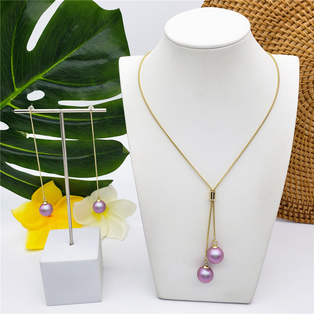 Set Of Chain Drop Earrings And Necklace Sustained With A Pearl In Different Colors