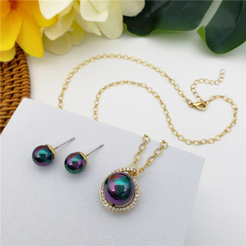 Set Of Metallic Green-Purple Pearl Stud Earrings And Eye Of The Universe Necklace With Metallic Green-Purple Pearl In Different Styles