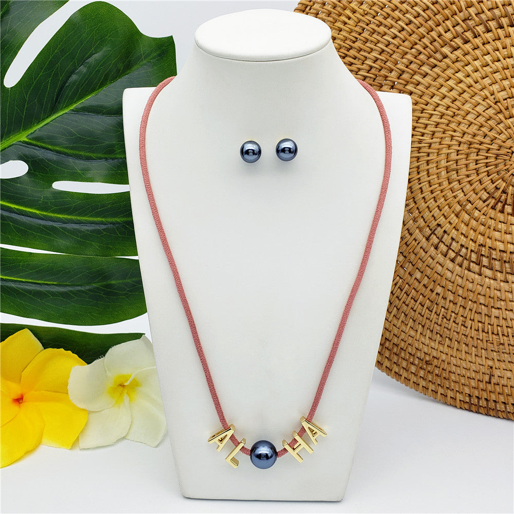 Set Of Petrol Pearl Stud Earrings And Leather Necklace In Different Colors With The Name Of An Island And Petrol Pearl