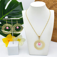 Set Of Carved Double Round Earrings And Necklace Sustained With A Pearl In Different Colors