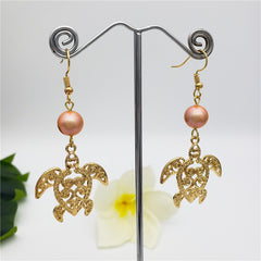 Hawaiian Sea Turtle Earrings Sustained With A Pearl In Different Styles And Colors