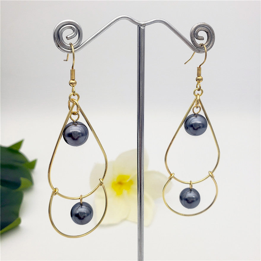 Double Teardrop Hook Earrings Sustained With Petrol Pearls