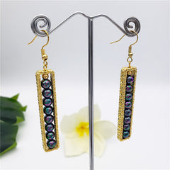 Carved Bar Drop Earrings Filled With Metallic Green-Purple Pearls And A Golden Bead