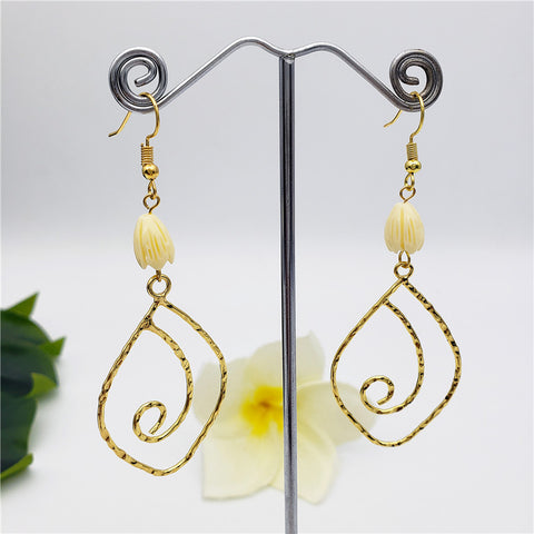 Swirly Flower Design Earrings Sustained With An Ivory Color Pikake Flower Bead