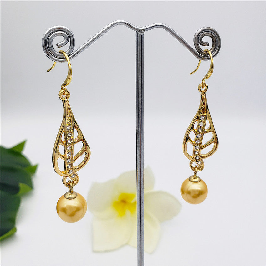 Golden Honey Drop Earrings With A Gold Pearl And White Zircons