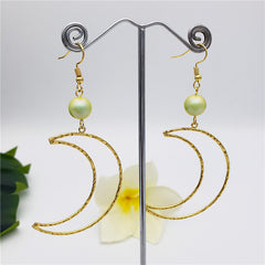 Crescent Moon Earrings Sustained With A Pearl In Different Colors