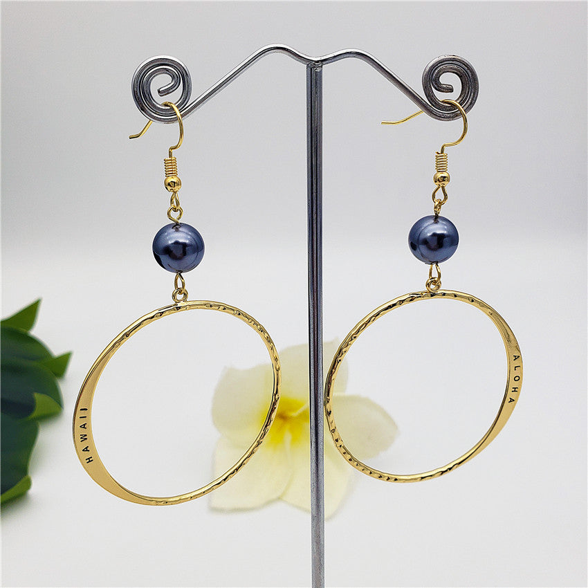 Hawaiian Circular Earrings Sustained With A Pearl In Different Colors