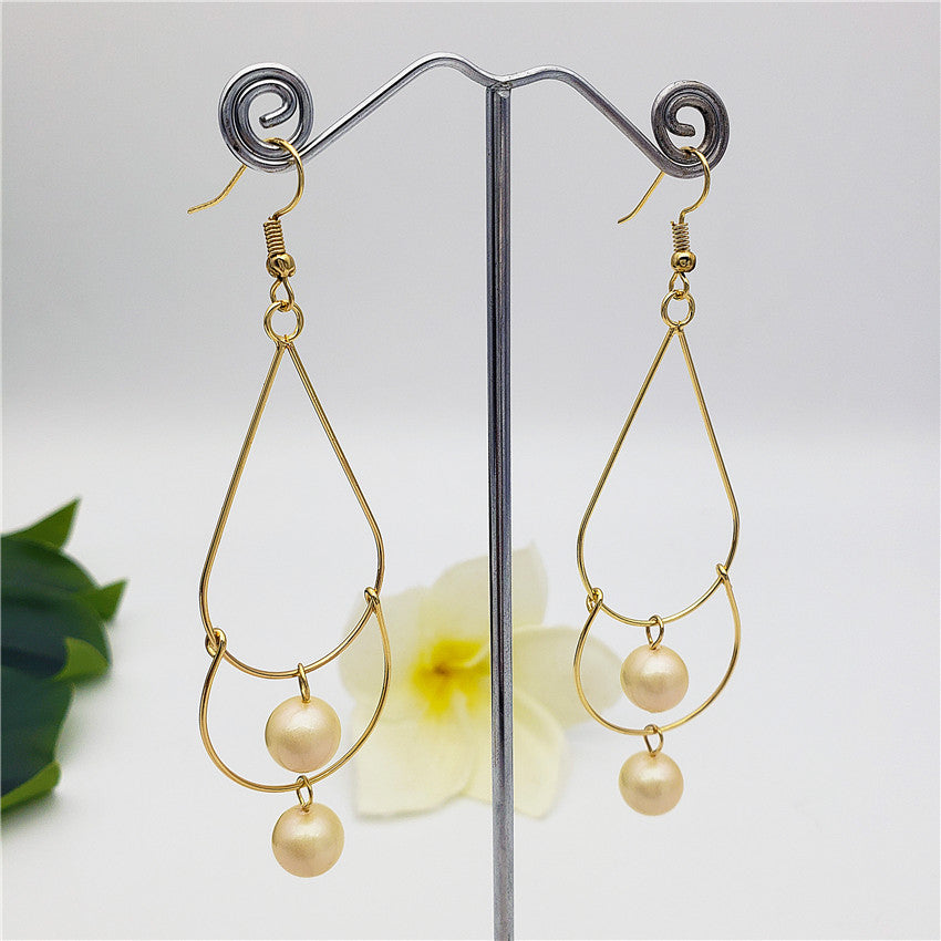 Double Teardrop Long Earrings Sustained With Pearls In Different Colors