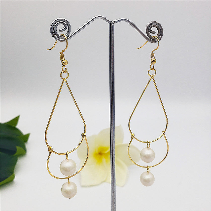 Double Teardrop Long Earrings Sustained With Pearls In Different Colors