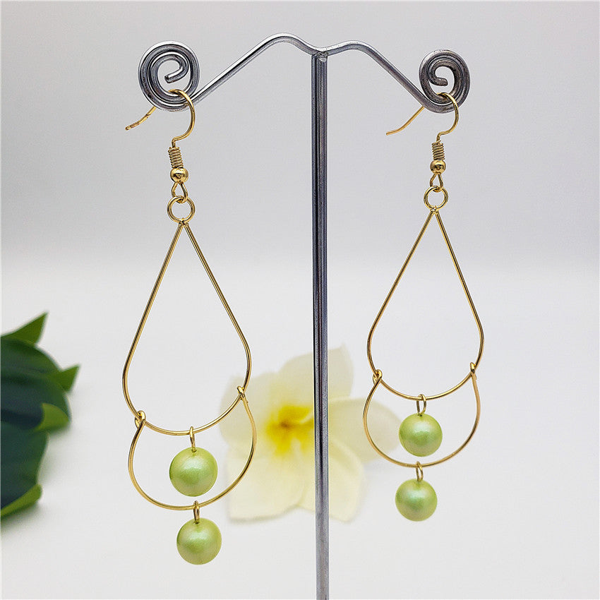 Double Teardrop Long Earrings Sustained With Pearls In Different Colors