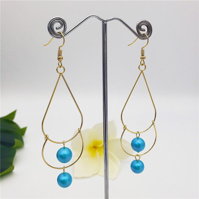 Double Teardrop Long Earrings Sustained With Pearls In Different Colors