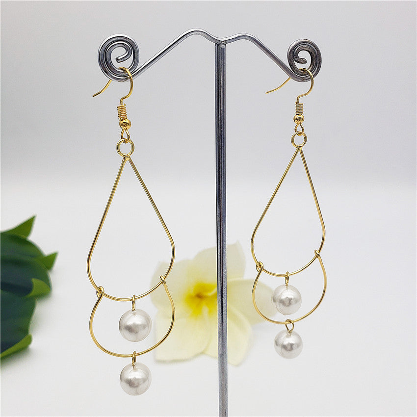 Double Teardrop Long Earrings Sustained With Pearls In Different Colors